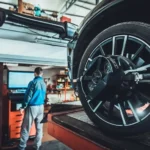 A person doing Mercedes Benz wheel alignment