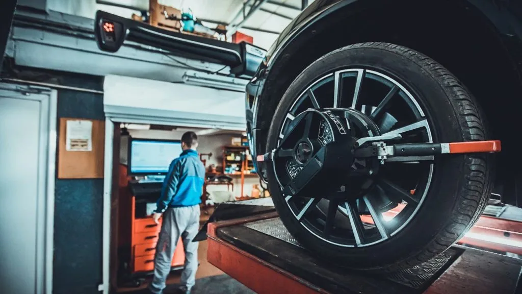 A person doing Mercedes Benz wheel alignment
