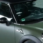 A mini Cooper in a Green wrap